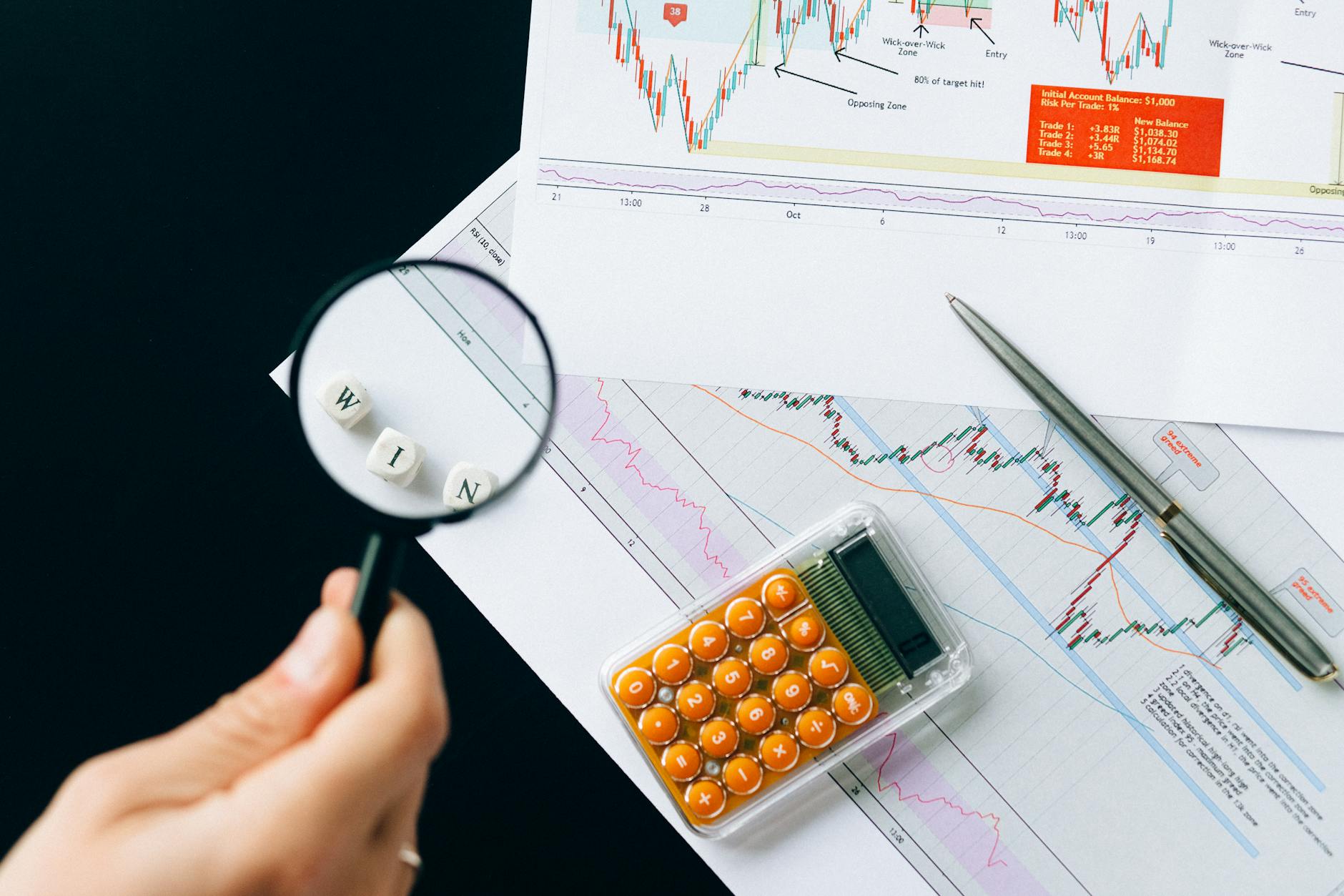 Ilustrasi: Magnifying glass highlighting the word 'WIN' over financial charts. Enhance your business analysis vision.
